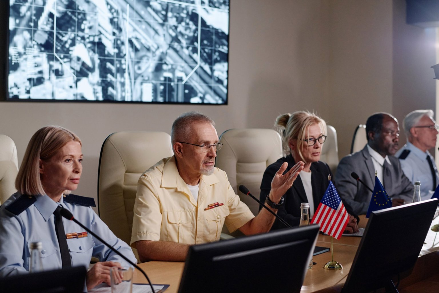 Public safety officials in a formal briefing meeting